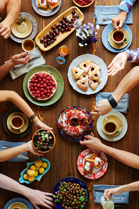 Thanksgiving dinner containing homemade baked desserts and fresh berries and fruits