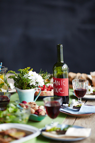 Bottle of organic wine on a table set for dinner