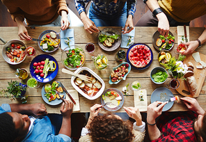 Group of young people eating dinner