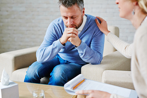 Man in deep upset visiting psychologist