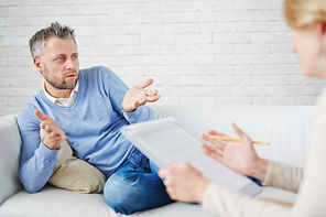 Man describing his problem to psychologist