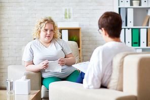 Young woman with overweight sharing her problem with psychologist