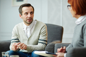 Man sharing his troubles during appointment with counselor