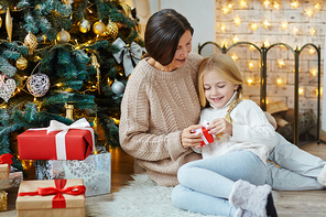 Grandmother making surprise to her granddaughter