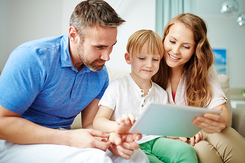 Modern young family networking at home