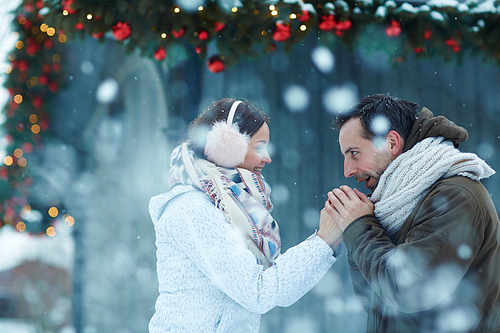 Amorous couple having date on frosty day