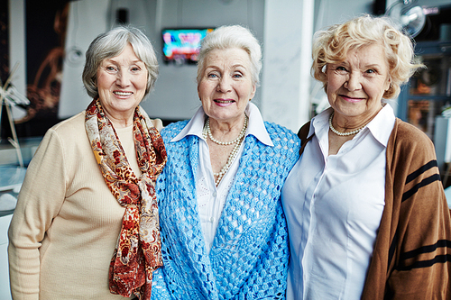 Portrait of three senior women smiling at camera