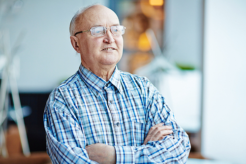 Elegant senior man in eyeglasses and shirt