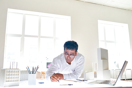 White collar worker carrying out his work in office