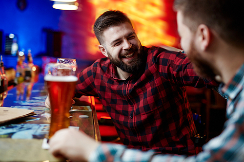 Two men spending time in pub