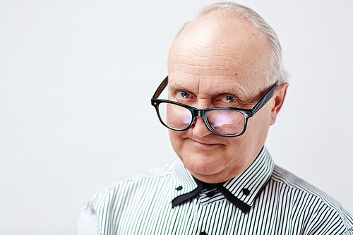 Senior man in eyeglasses and striped shirt 