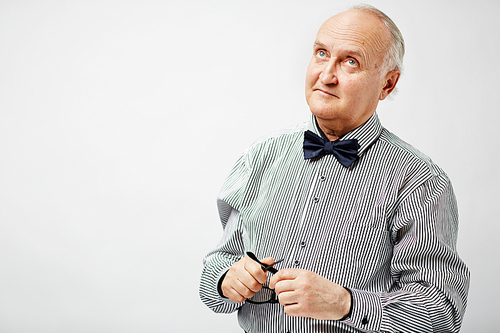 Senior gentleman wearing striped shirt and black bowtie