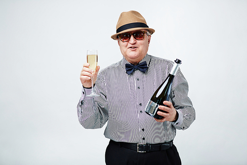 Elegant senior man toasting with champagne