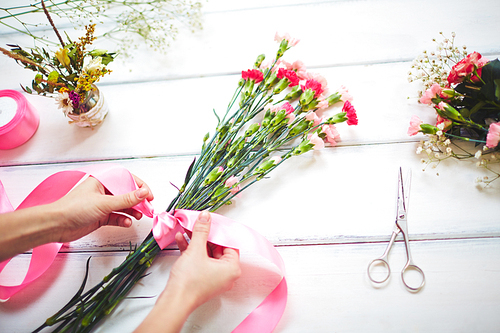 Close-up of florist making a bouquet