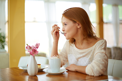 Young woman enjoying coffee time at cafe