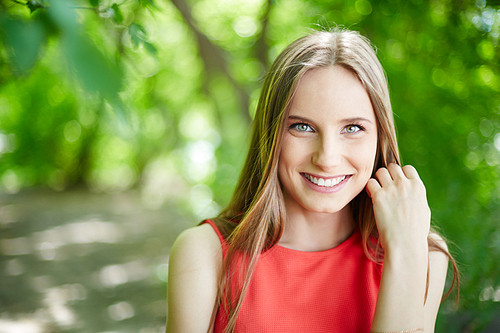 Portrait of young pretty girl smiling at camera