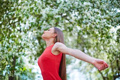 Delighted girl enjoying summer day