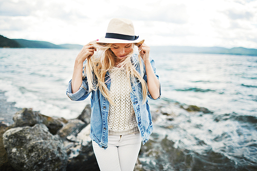 Young woman spending weekend by the seaside