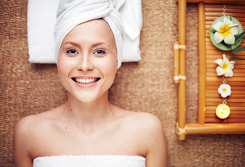 Happy girl enjoying aromatherapy