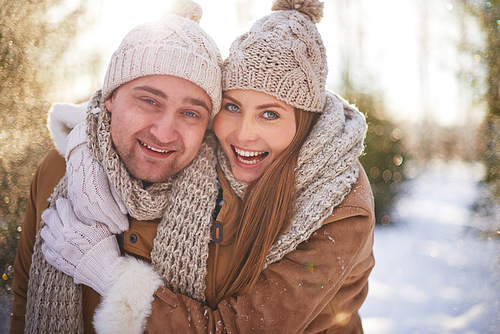 Portrait of happy couple having fun in winter day