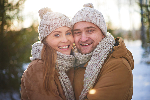 Joyful sweethearts in winterwear  outdoors