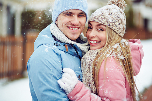 Portrait of happy couple in snow
