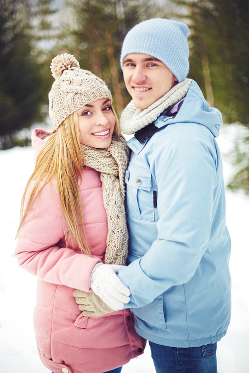 Young couple in winterwear  in park