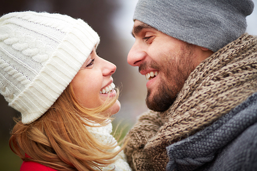 Smiling guy and girl looking at one another