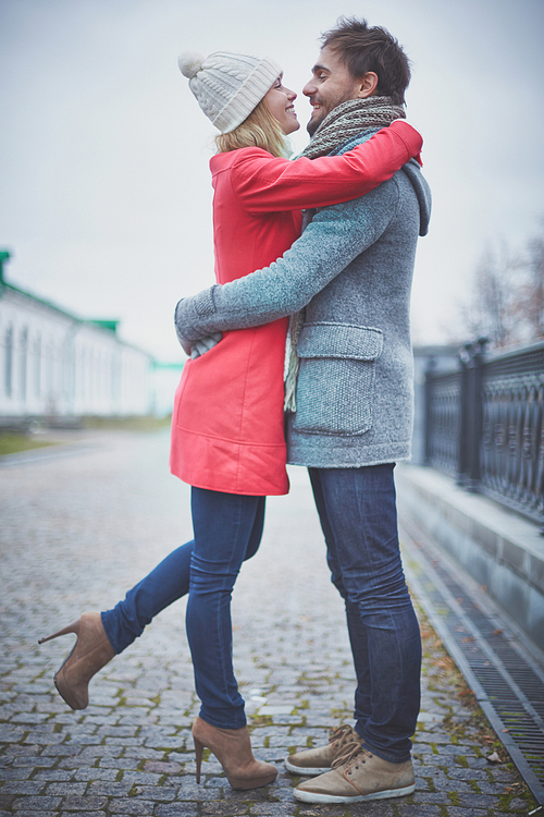 Affectionate dates embracing in urban environment