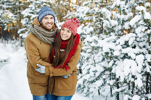 Young dates in winterwear  outside