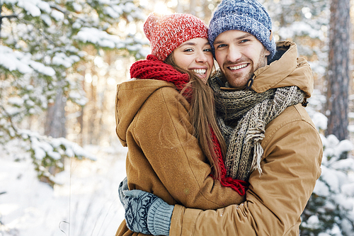 Embracing dates in winterwear  in natural environment