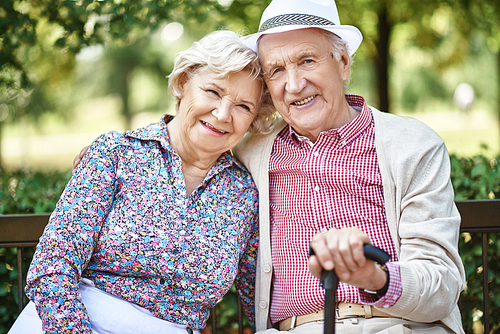 Smiling senior couple in smart casual-wear  in natural environment