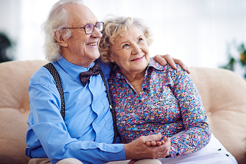 Affectionate aged couple in smart clothes