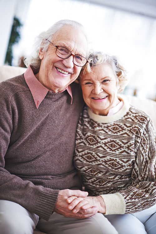 Laughing senior couple in sweaters 
