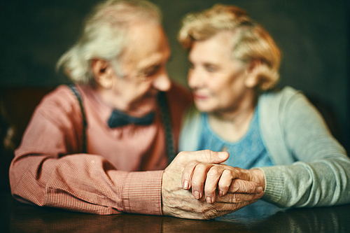 Close-up of senior man and woman hands