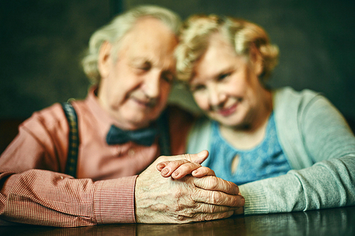 Close-up of hands of affectionate seniors