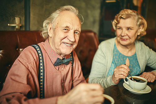 Happy seniors sitting in cafe