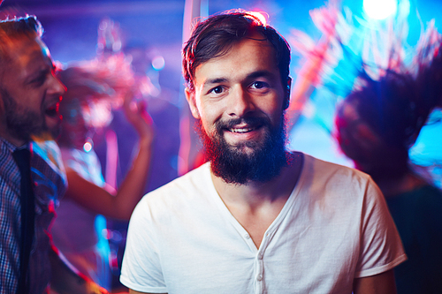 Young bearded man in nightclub