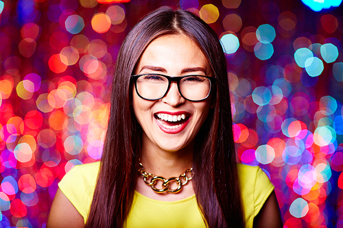 Young woman in glasses laughing