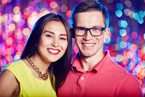 Cheerful couple  at party in nightclub