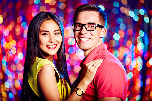 Cheerful young couple  in nightclub