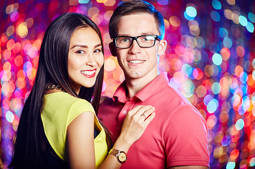 Cheerful couple enjoying party in nightclub