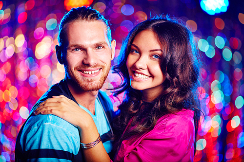 Couple of romantic guy and girl enjoying night clubbing
