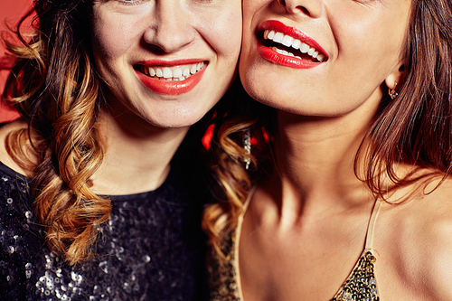 Happy young women with toothy smiles
