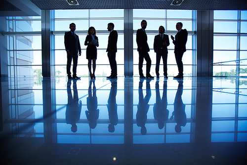 Row of people in formalwear in the dark