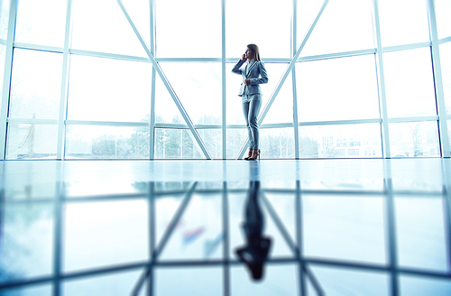 Businesswoman speaking on the cellphone in office