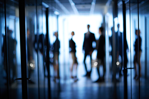 Blurred motion of business team standing at office