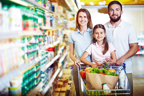 Caucasian family  in modern hypermarket