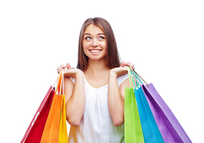 Female shopper with several paperbags after shopping