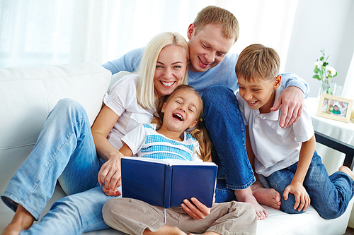Joyful family reading together